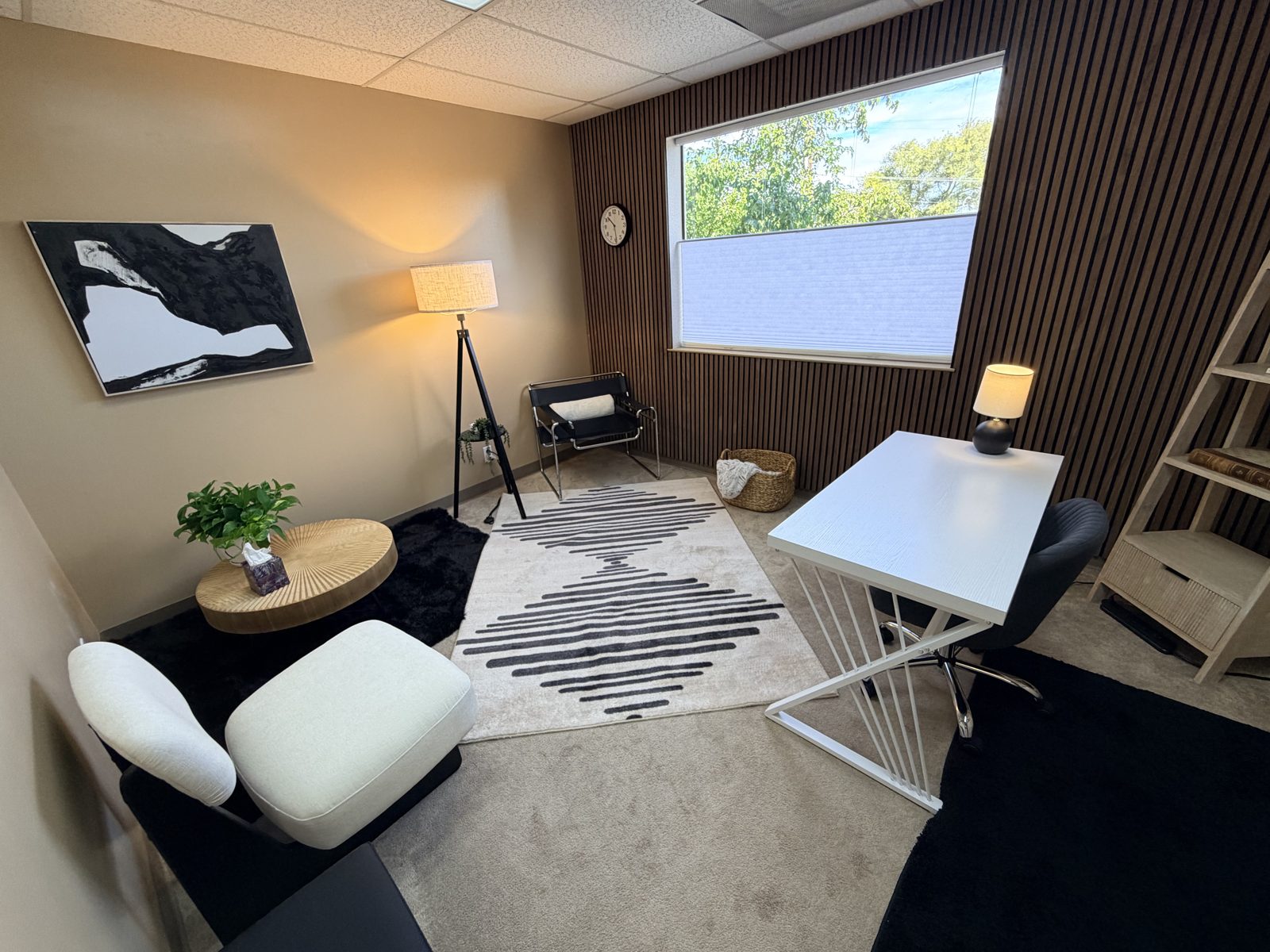 FocusRooms Room 3 — furnished therapy office with couch, desk and natural light
